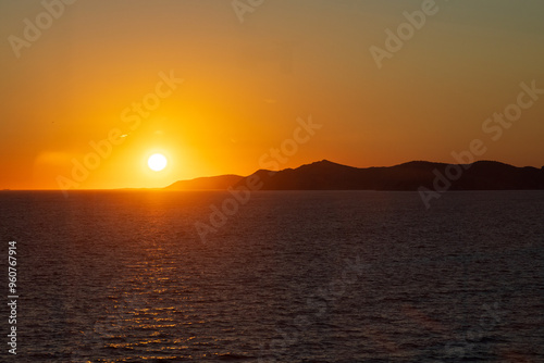 Fototapeta Naklejka Na Ścianę i Meble -  Greek sunsets over the Aegean sea during summer 