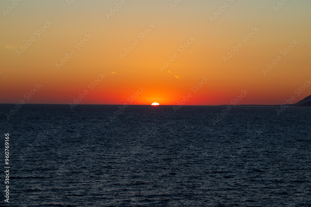 Greek sunsets over the Aegean sea during summer Greek sunsets over the Aegean sea during summer