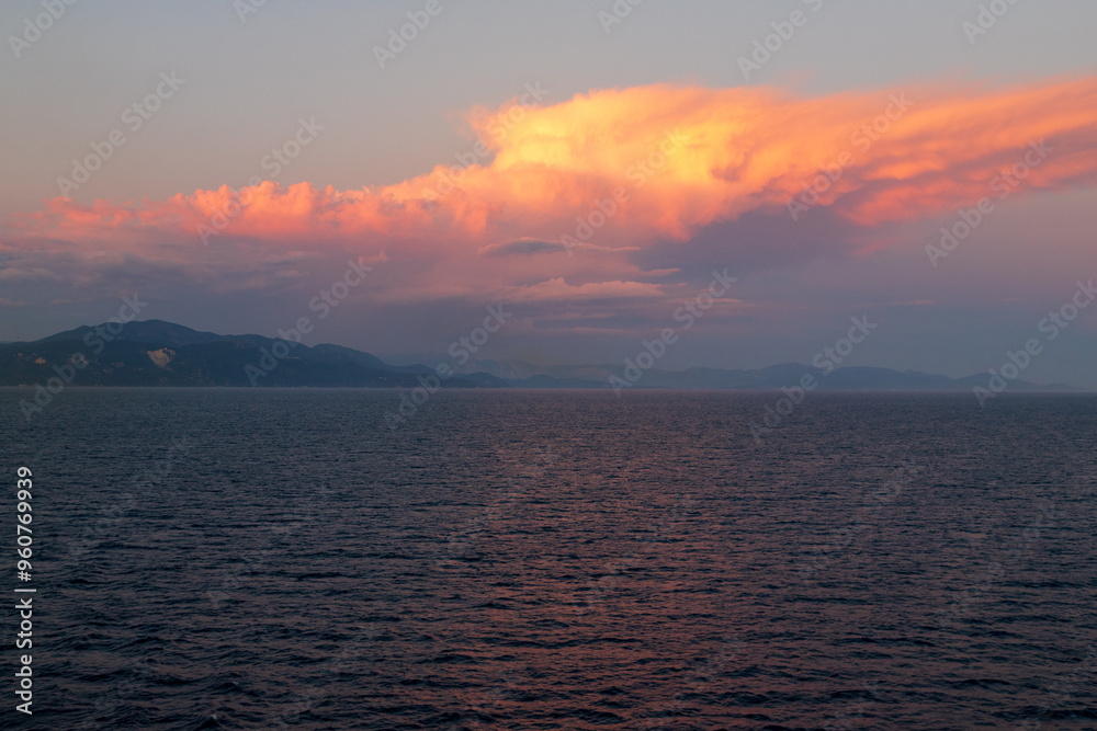 Greek sunsets over the Aegean sea during summer Greek sunsets over the Aegean sea during summer