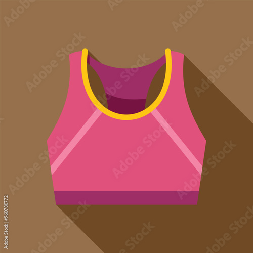 Pink sports bra with yellow trim laying flat on a brown background
