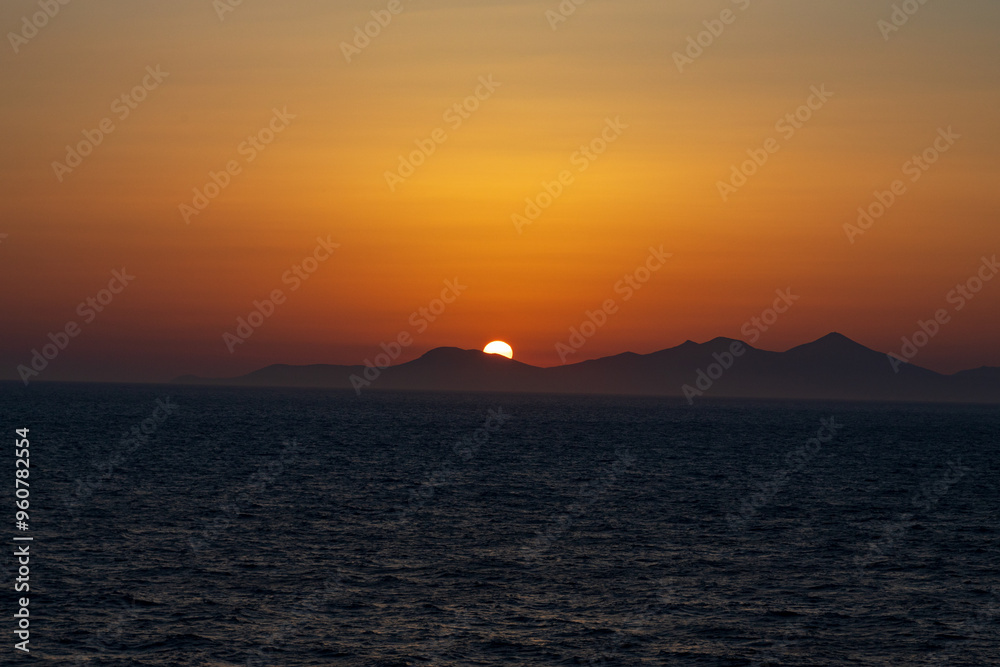 Greek sunsets over the Aegean sea during summer Greek sunsets over the Aegean sea during summer