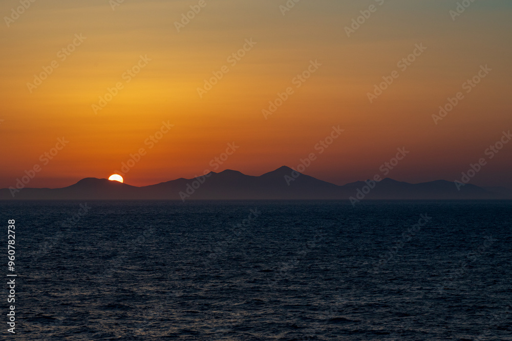 Greek sunsets over the Aegean sea during summer Greek sunsets over the Aegean sea during summer