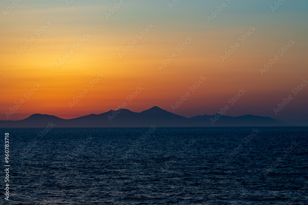 Greek sunsets over the Aegean sea during summer Greek sunsets over the Aegean sea during summer