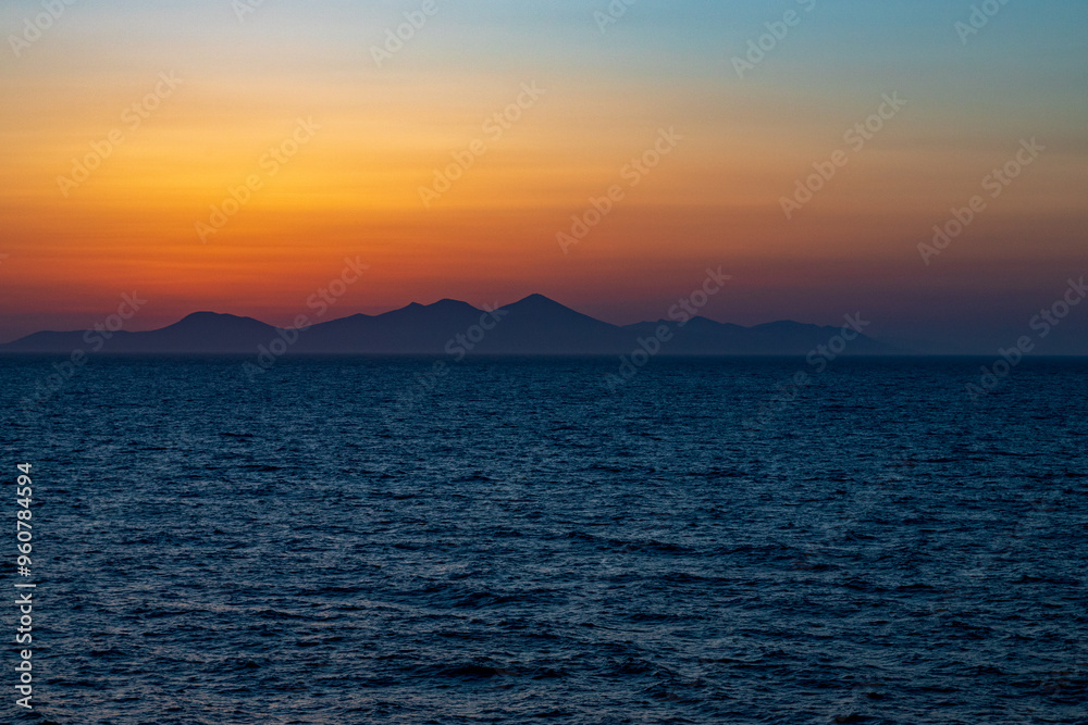 Greek sunsets over the Aegean sea during summer Greek sunsets over the Aegean sea during summer