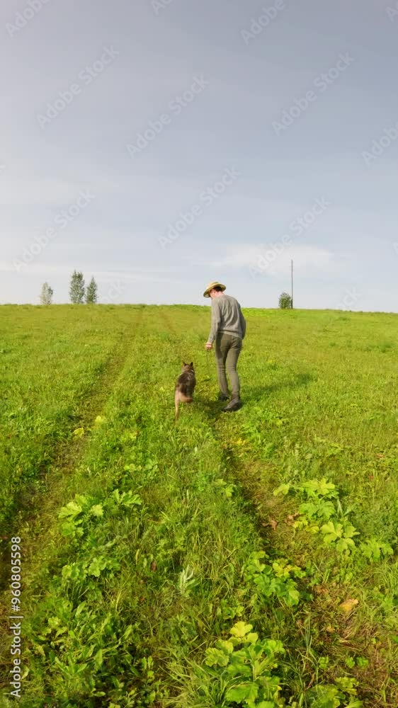 Farmer wearing a straw hat runs joyfully through a vibrant green field, playing fetch with his energetic dog on a beautiful summer day filled with sunshine and happiness Farmer wearing a straw hat runs joyfully through a vibrant green field, playing fetch with his energetic dog on a beautiful summer day filled with sunshine and happiness