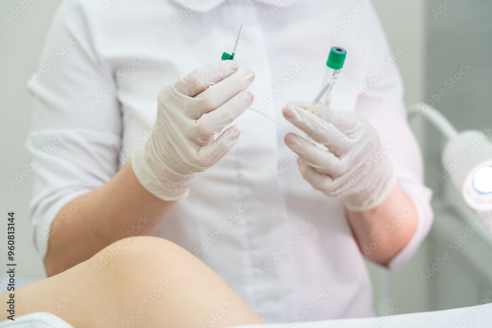 Gynecologist holding empty plasmolifting device before using it Gynecologist holding empty plasmolifting device before using it
