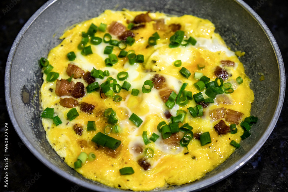 Traditional omelette with bacon and chives, real food, strong and nutritious protein