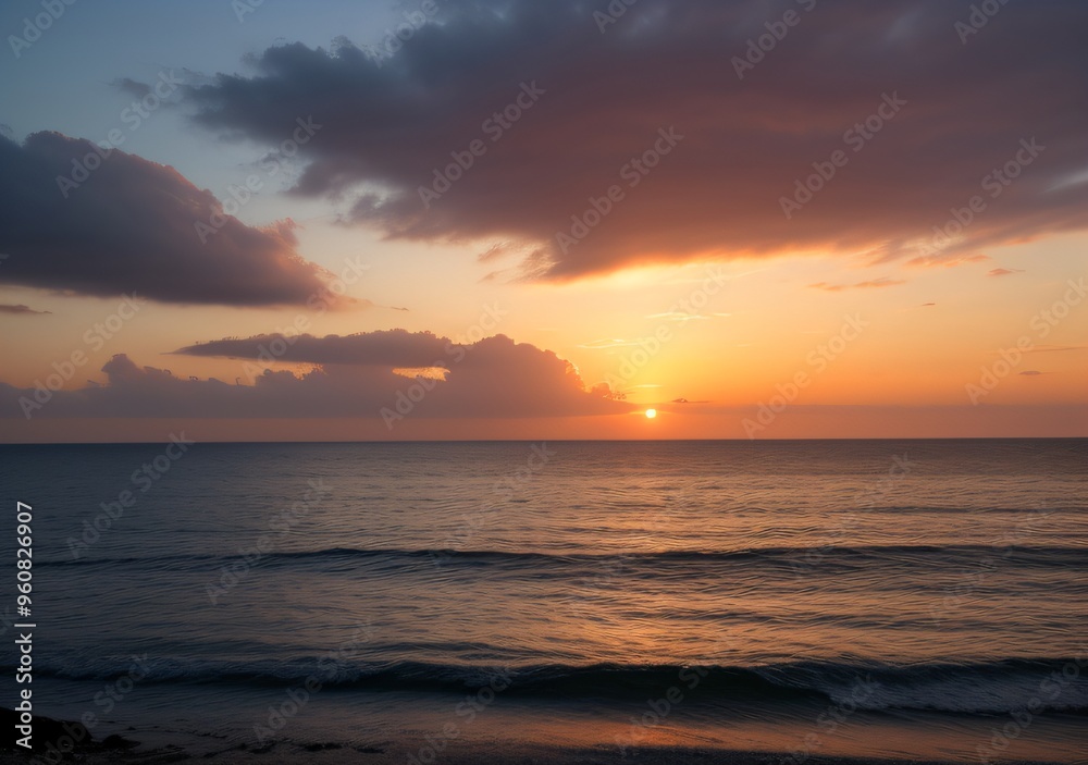 Obraz premium Sunset Over Calm Ocean Waves