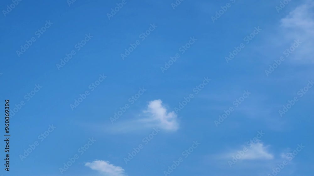 White Clouds Moving Across a Blue Sky White Clouds Moving Across a Blue Sky