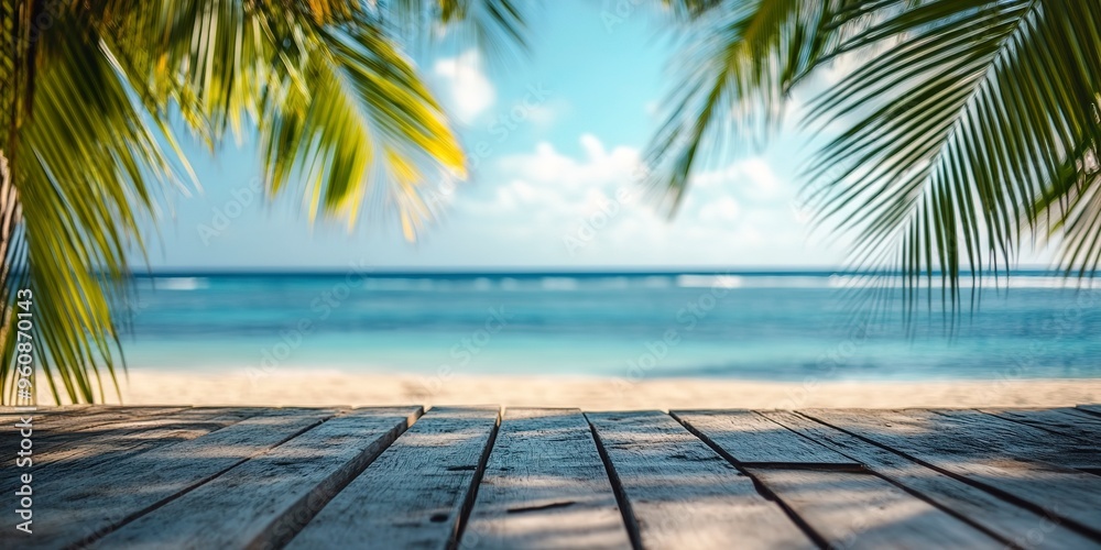 Tropical beach view from wooden pier with blurred palm leaves and ocean background, vacation concept. Tropical beach view from wooden pier with blurred palm leaves and ocean background, vacation concept.