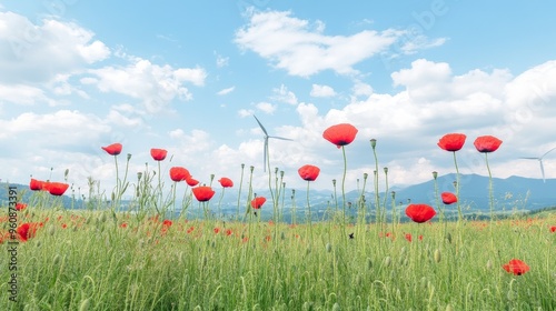 Majestic wind turbines spin gracefully above a vibrant red poppy field, contrasting the gentle flowers with the power of renewable energy