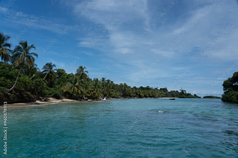 Tropical Beach Paradise with Clear Water, Palm Trees, and Blue Sky - A Serene, Unspoiled Island Destination Offering Eco-Tourism and Adventure Travel in a Beautiful, Scenic Caribbean Setting Tropical Beach Paradise with Clear Water, Palm Trees, and Blue Sky - A Serene, Unspoiled Island Destination Offering Eco-Tourism and Adventure Travel in a Beautiful, Scenic Caribbean Setting
