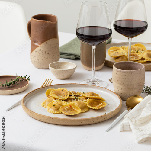 Photography Elegant table, no plastic, ceramic tableware, wine in glasses and white linen, r