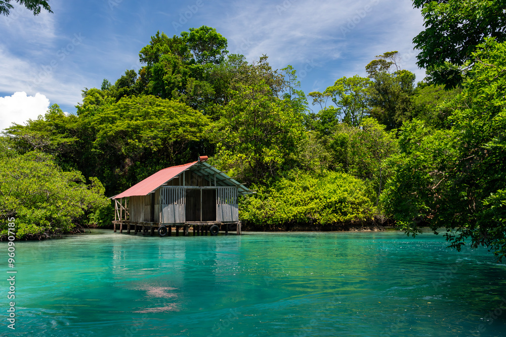 Tropical Waterfront Hut on the Pristine Island of Escudo de Veraguas, Panama, Surrounded by Crystal Clear Waters and Lush Nature, Perfect for an Eco-Friendly Getaway or Remote Vacation Tropical Waterfront Hut on the Pristine Island of Escudo de Veraguas, Panama, Surrounded by Crystal Clear Waters and Lush Nature, Perfect for an Eco-Friendly Getaway or Remote Vacation