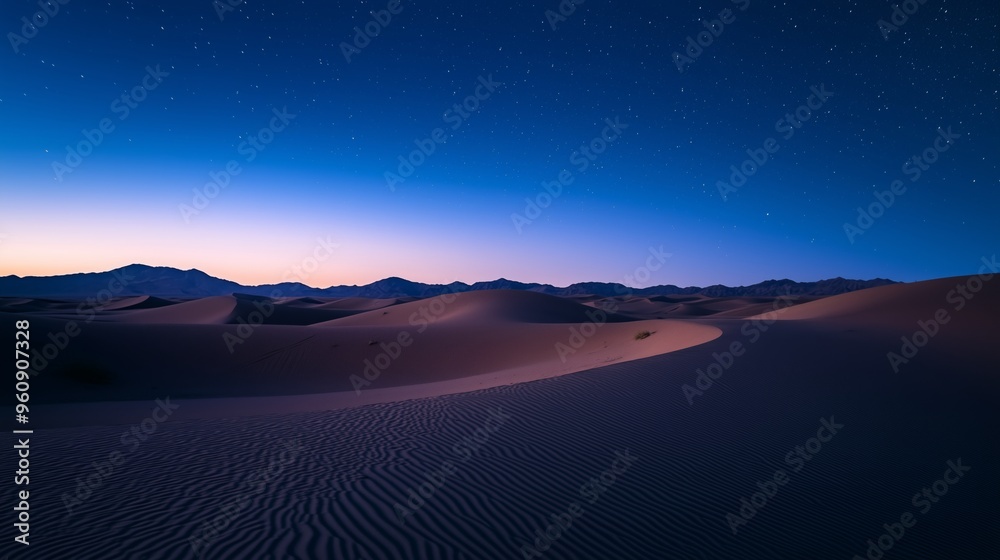 The sunrise gently illuminates the desert during the early hours of the morning. The darkness of the night begins to dissipate, as warm hues of orange and pink tint the horizon. The sunrise gently illuminates the desert during the early hours of the morning. The darkness of the night begins to dissipate, as warm hues of orange and pink tint the horizon.