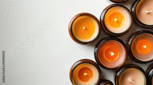 Handmade soy and coconut wax candles in amber and opaque jars on white background. Organic, trendy DIY candles. Vegan, with room for text. Banner design. photo