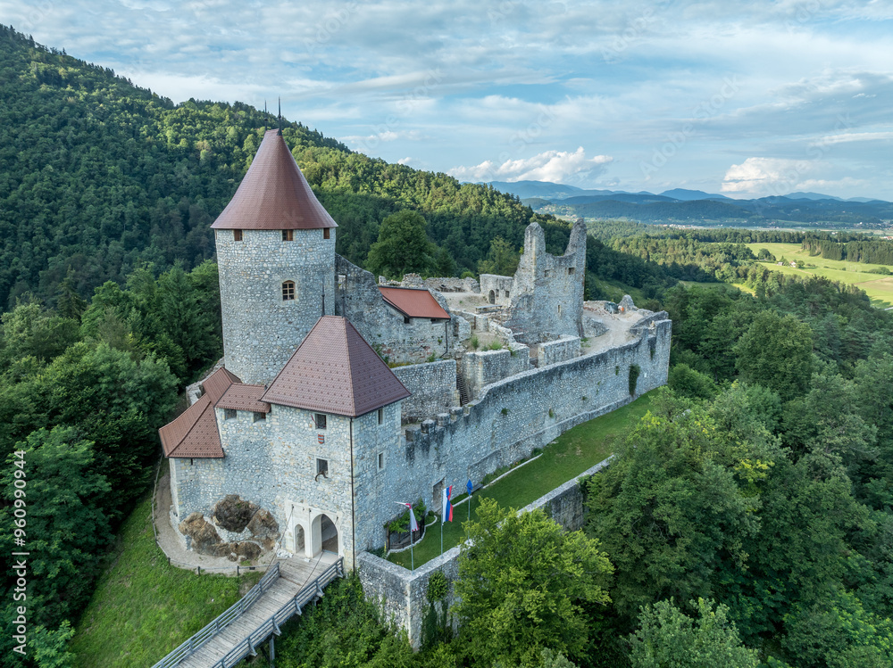 Aerial panoramic view of Zovnek castle, oldest medieval stronghold in Slovenia with partially restored great tower, castle gate, draw bridge Aerial panoramic view of Zovnek castle, oldest medieval stronghold in Slovenia with partially restored great tower, castle gate, draw bridge