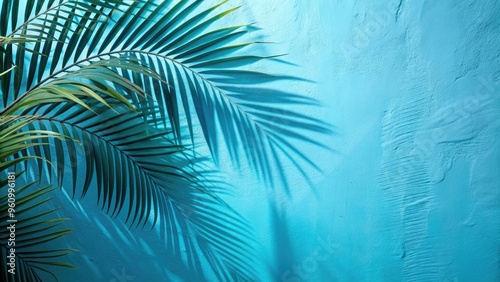 Cool blue wall with soft, blurred palm leaf shadows creating a tranquil background, blue, wall, shadows, palm, leaves