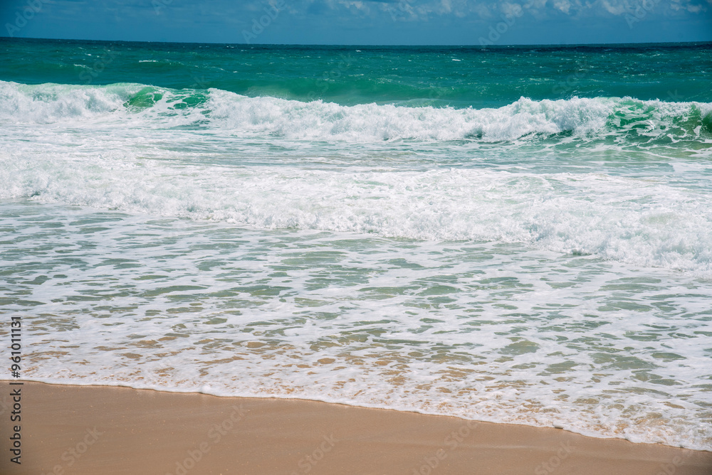 Summer tropical beach white sand blue sea summertime on sunny day. Sea coast beach scenery foamy wave on the beach waves of blue sea tropical ocean sand. Travel holidays vacation seaside turquoise Summer tropical beach white sand blue sea summertime on sunny day. Sea coast beach scenery foamy wave on the beach waves of blue sea tropical ocean sand. Travel holidays vacation seaside turquoise