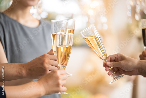 Image of toasting with champagne and wine glasses Close-up of hands without face