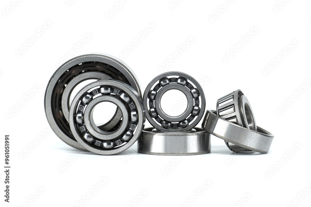 Set of metal ball bearings in various sizes isolated on a white background Set of metal ball bearings in various sizes isolated on a white background