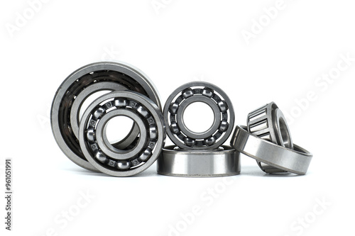 Set of metal ball bearings in various sizes isolated on a white background photo