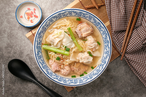 Egg Noodles and dumplings with braised pork ribs in clear noodle soup