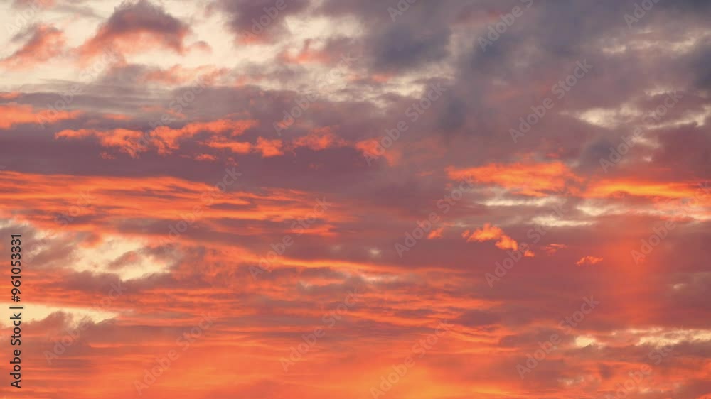 A stunning sunset sky with fluffy clouds and warm colors that inspire awe and wonder A stunning sunset sky with fluffy clouds and warm colors that inspire awe and wonder