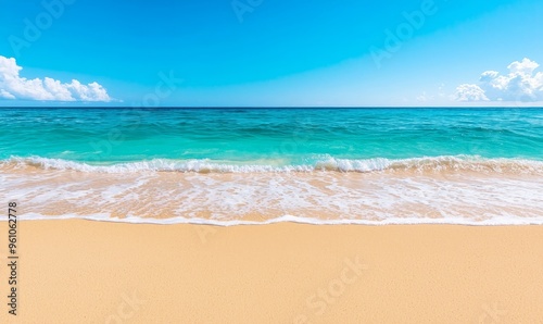 tranquil seascape with azure sky, foamy waves, and golden sand beach.