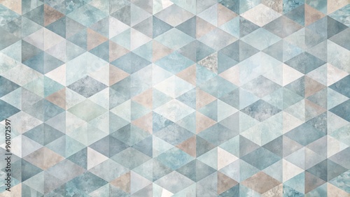 Faded geometric patterns on a soft, grey-blue background, with abstract shapes blending into one another for a dreamy effect. photo