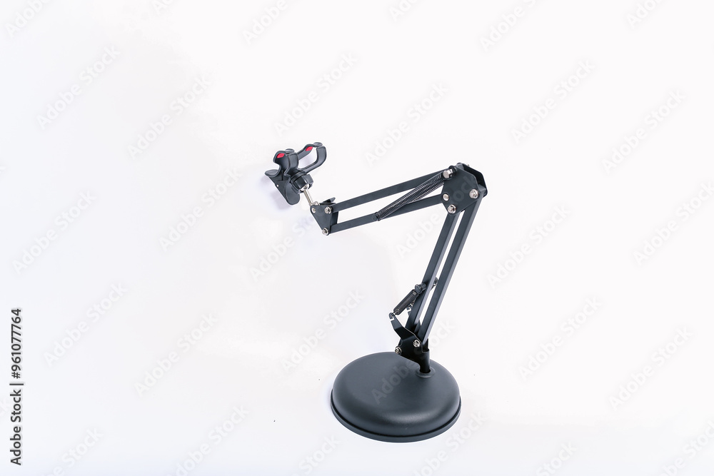 Black Phone holder stand that can be adjusted to height angle isolated on white background. holder for phone, phone stand, mount, universal Black Phone holder stand that can be adjusted to height angle isolated on white background. holder for phone, phone stand, mount, universal