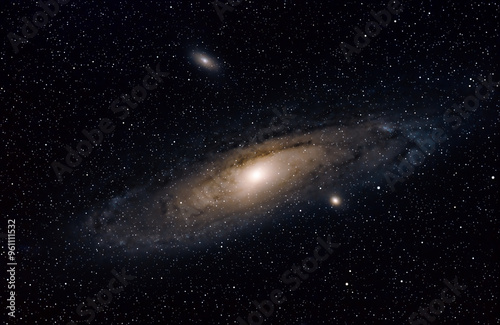 Obraz na płótnie The Andromeda Galaxy in the constellation Andromeda. The Andromeda Galaxy, also known as Messier 31 (M31), is a spiral galaxy that's the closest major galaxy to the Milky Way w salonie