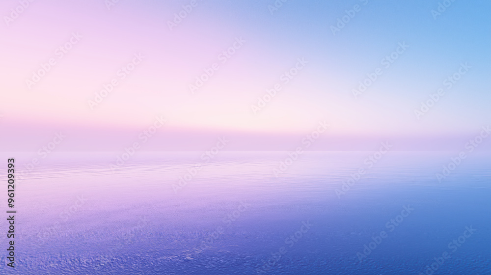 A beautiful blue ocean with a pink sky in the background