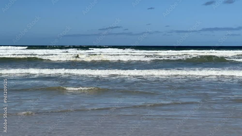 Kayak surfing the white surf waves of the blue ocean Kayak surfing the white surf waves of the blue ocean