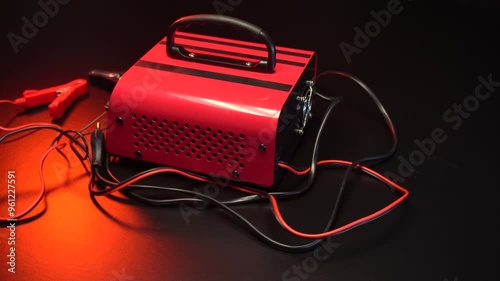 red new car battery charger with ammeter and terminals for 6 volts and 12 volts