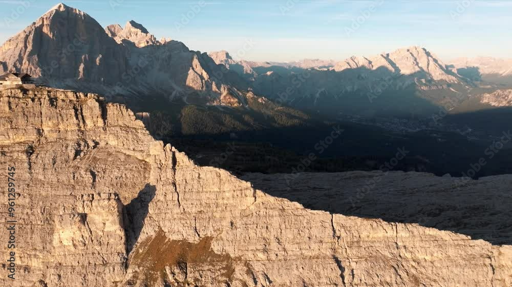 Aerial view of mountain peaks during sunrise in the Dolomites, Italy