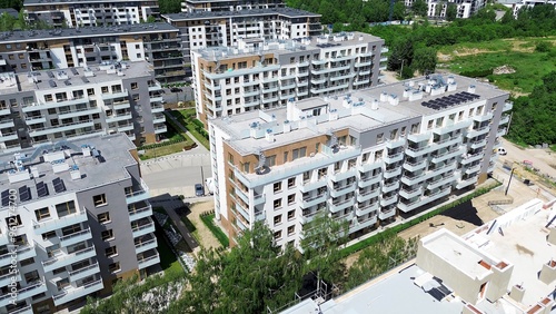 Modern apartment buildings with green surroundings viewed from above