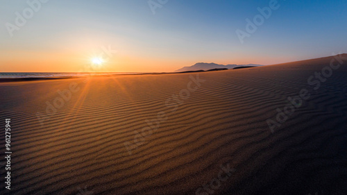 Fototapeta Naklejka Na Ścianę i Meble -  Patara sand dunes, located in Kaş district of Antalya, continue for 18 kilometers. The sand dunes, which constantly present different shapes and graphics with the effect of the wind, are worth watchin