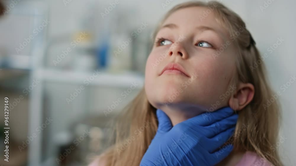 Closeup pediatrician checking throat after disease. Cute blond girl open mouth Closeup pediatrician checking throat after disease. Cute blond girl open mouth