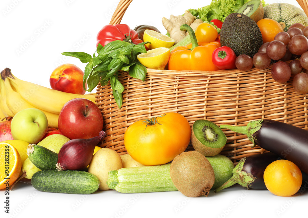 Many different fruits and vegetables in wicker basket isolated on white Many different fruits and vegetables in wicker basket isolated on white