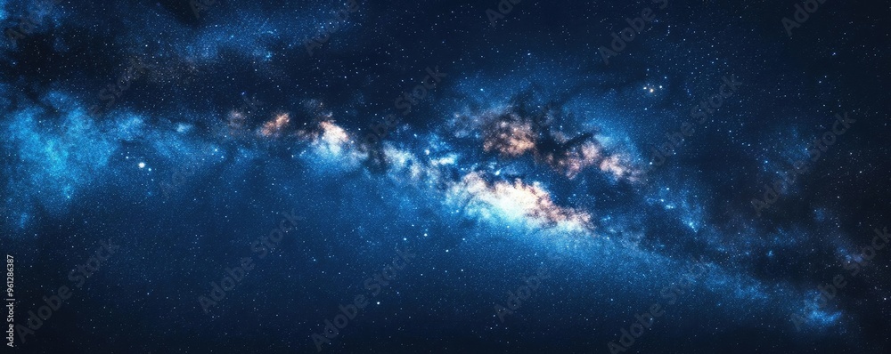 Obraz premium A starry night sky with a clear view of the Milky Way, creating a sense of wonder and vastness