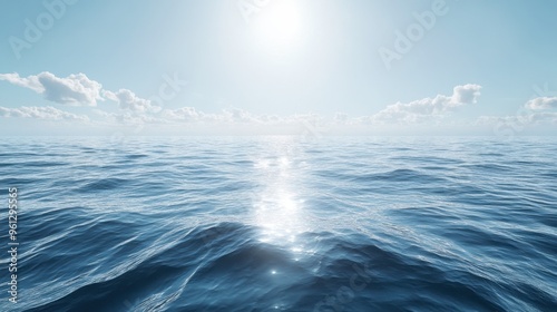 A clear sky over a calm ocean, with gentle waves reflecting the bright sunlight and creating a peaceful scene.