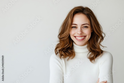 Portrait of young happy woman looks in camera