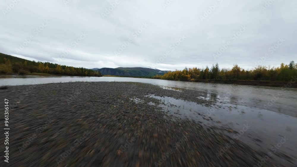 Experience the breathtaking natural beauty of Yakutia as a drone glides over rivers and autumn foliage, showcasing the region's stunning contrasts in a unique way. Experience the breathtaking natural beauty of Yakutia as a drone glides over rivers and autumn foliage, showcasing the region's stunning contrasts in a unique way.