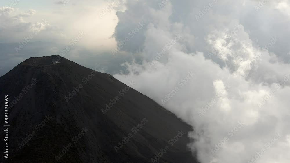 Izalco Volcano active crater peak covered in fog, high altitude El Salvador Izalco Volcano active crater peak covered in fog, high altitude El Salvador