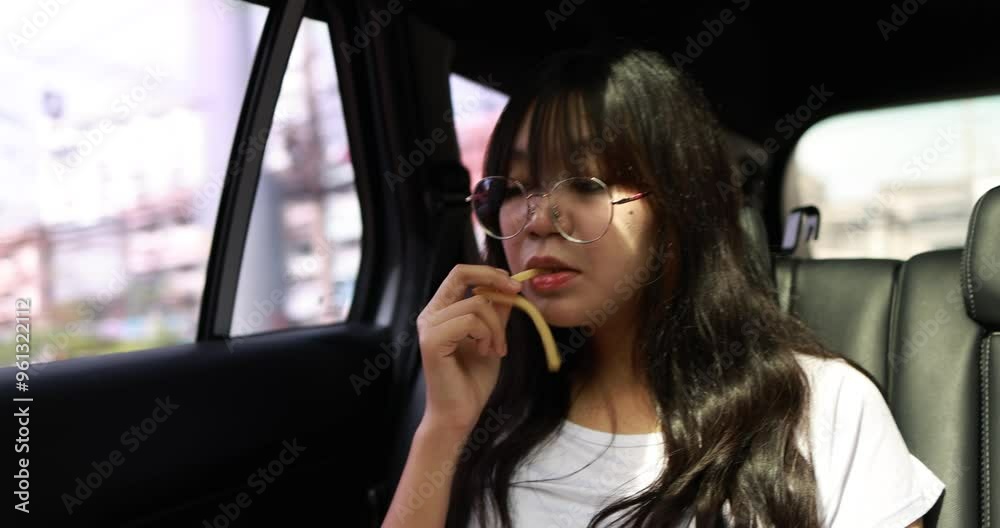 girl eating Fast food in cars During the trip to study on holiday girl eating Fast food in cars During the trip to study on holiday