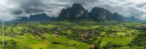 Lush Green Rice Paddies, Picturesque Villages, and Towering Karst Mountains in Vang Vieng, Laos