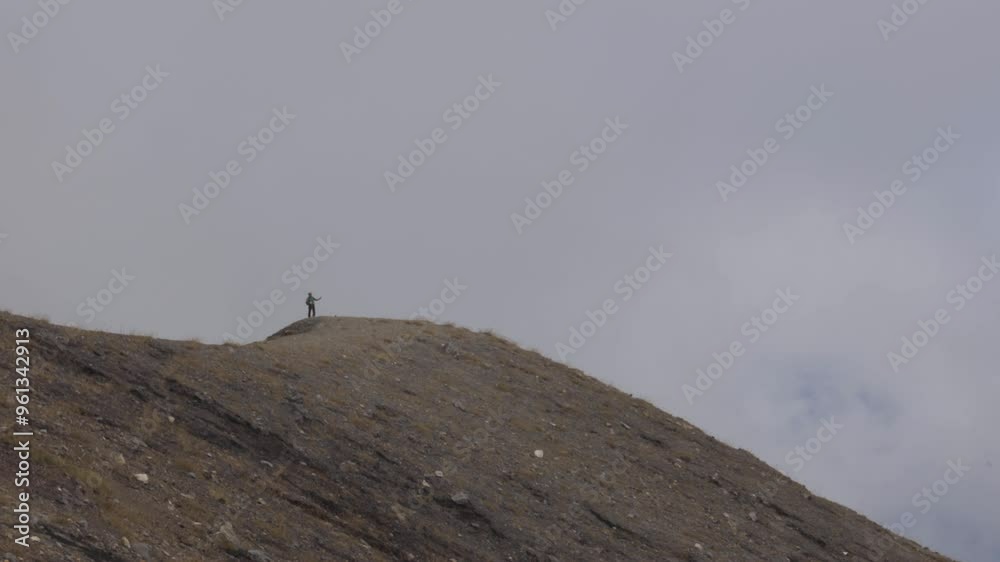Hiker at edge of the volcano crater Santa Ana in El Salvador high altitude Hiker at edge of the volcano crater Santa Ana in El Salvador high altitude