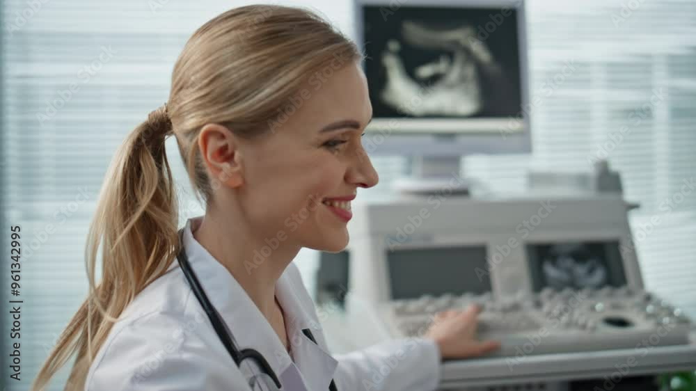 Doctor checking ultrasound monitor in clinic closeup. Smiling pregnant woman Doctor checking ultrasound monitor in clinic closeup. Smiling pregnant woman