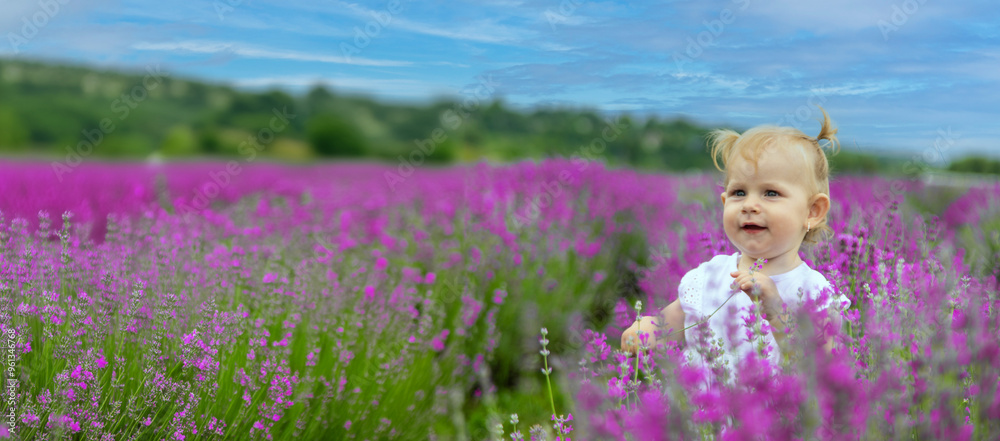 little beautiful girl in a white dress in a lavender field or garden, enjoying the aroma of lavender little beautiful girl in a white dress in a lavender field or garden, enjoying the aroma of lavender